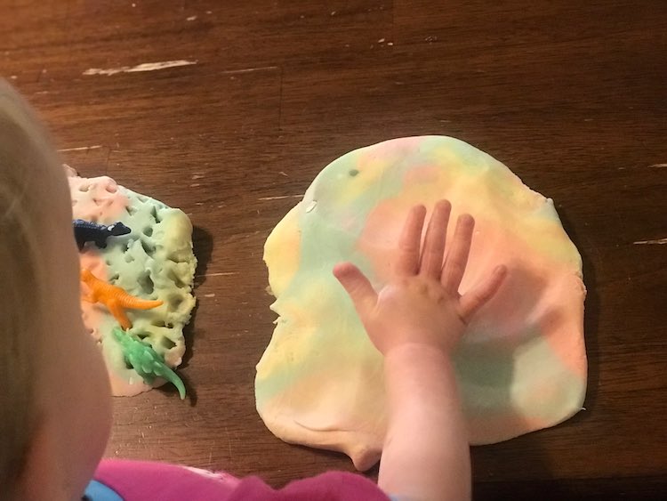 With Zoey that first time I made each dinosaur walk the length of the playdough and then stay at the end before marching the next dinosaur until the patch of playdough was filled.