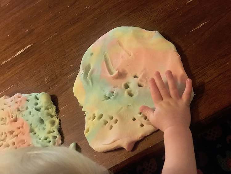 Then she decorated the second patch of playdough.