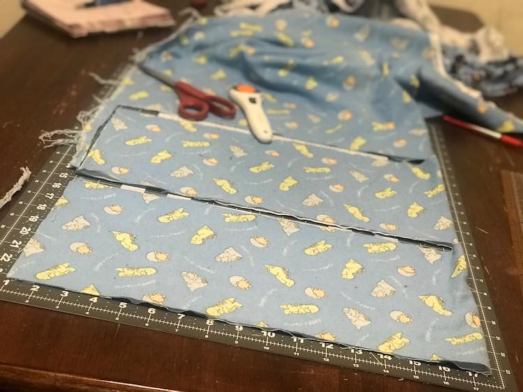 After folding the dinosaur fabric I cut it two long rectangles. Folded it was about 16 by 8 inches but unfolded about 32 inches long.