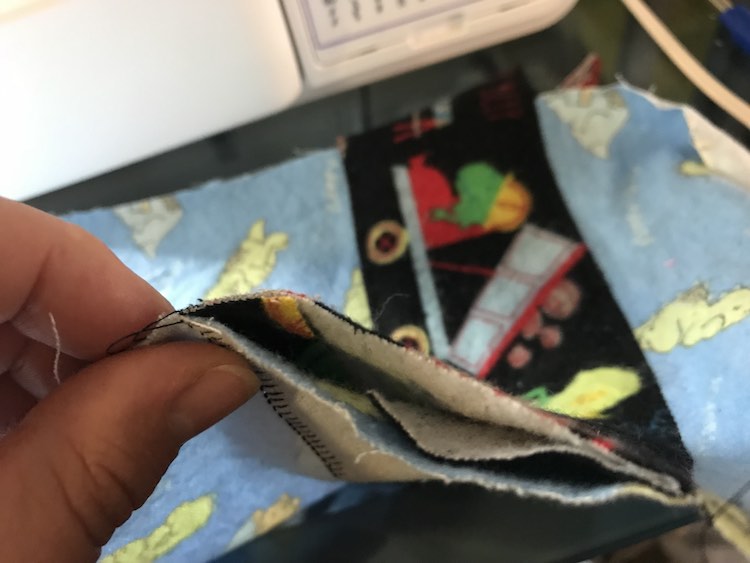 If you look inside the you can see where the fabric is folded in.