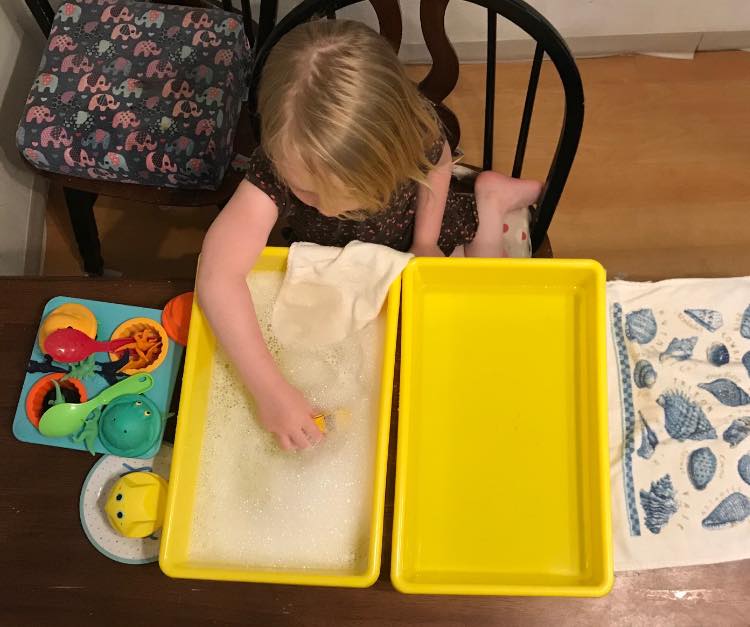 Setting up the sensory station to wash the 'dusty musties' from our toys.