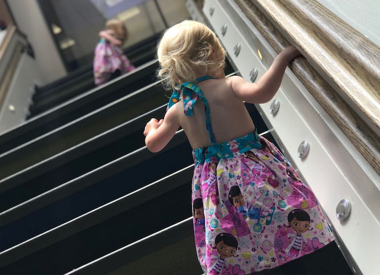 Heading up the stairs in their new dresses.