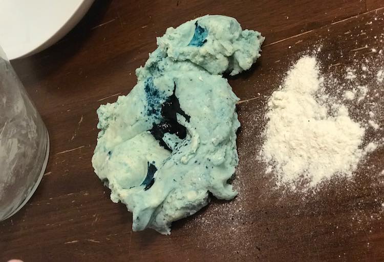 Before kneading the playdough together I added more blue dye to make it darker.