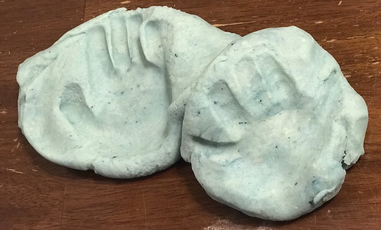 Zoey also wanted to touch the new and warm playdough so we made quick handprints before combining it and setting it aside.