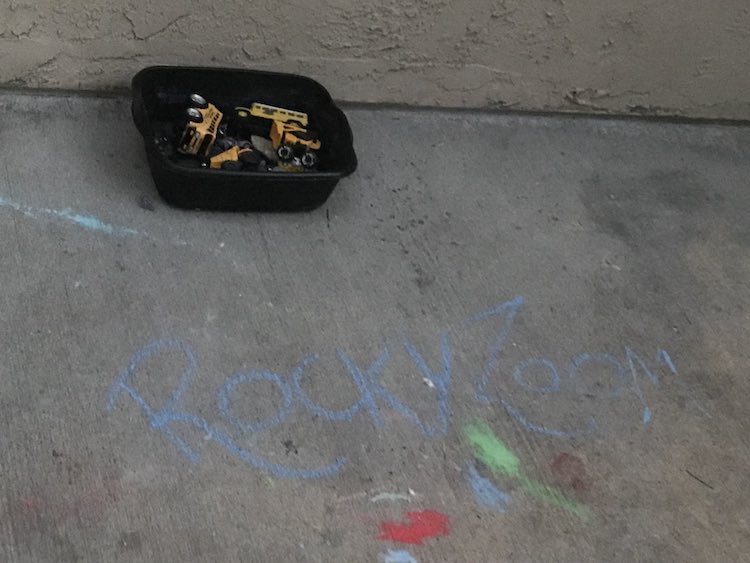 Set the rocks and vehicles out the night before and labelled the space with sidewalk chalk. I kept the rocks in their packaging so they wouldn't mix together.