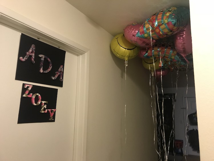I bought twelve balloons from the Dollar Tree the day before with the kids. Before going to be I gathered them in the hallway so they'd have to walk through them on the way to the kitchen in the morning.