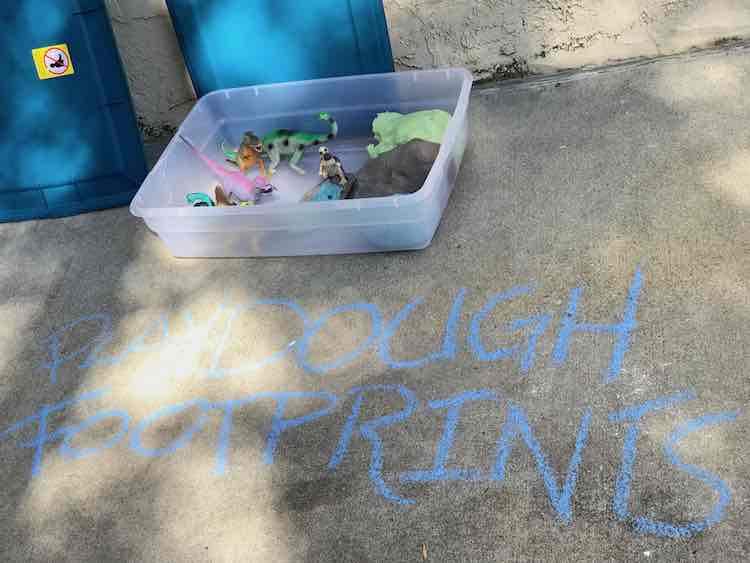 Before the party started I opened the playdough and created a quick scene in front of the one dinosaur before putting the lid back on for when we were ready.