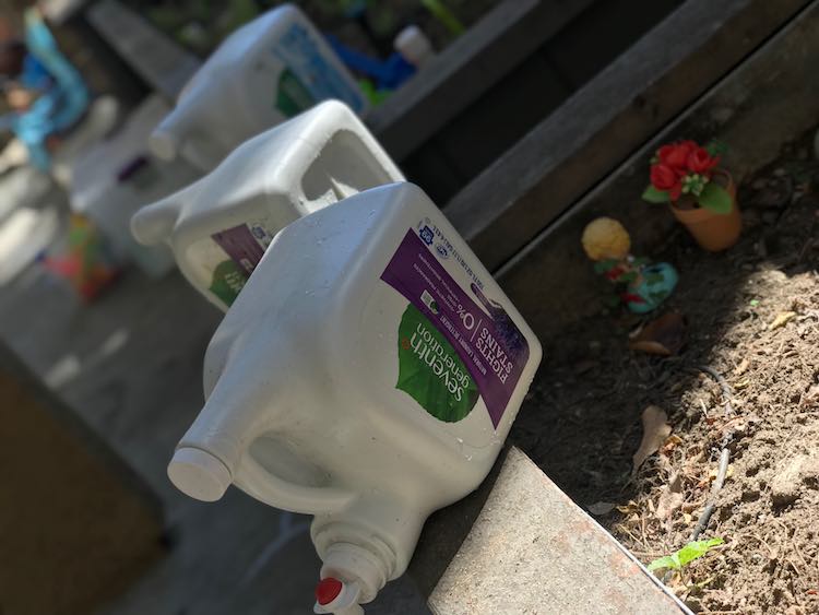 After filling the water bottles were placed along the edge of the garden boxes for easy access.