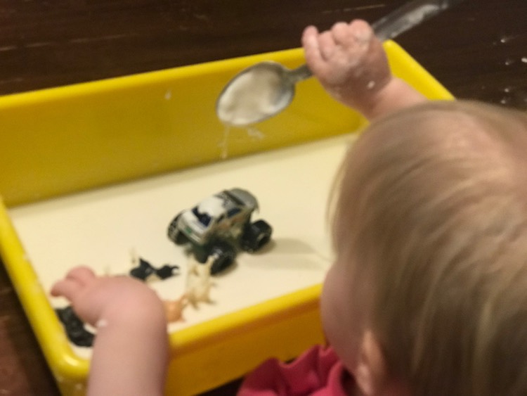 Zoey playing with oobleck inside.