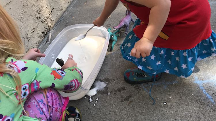 Ada and Zoey playing with oobleck.