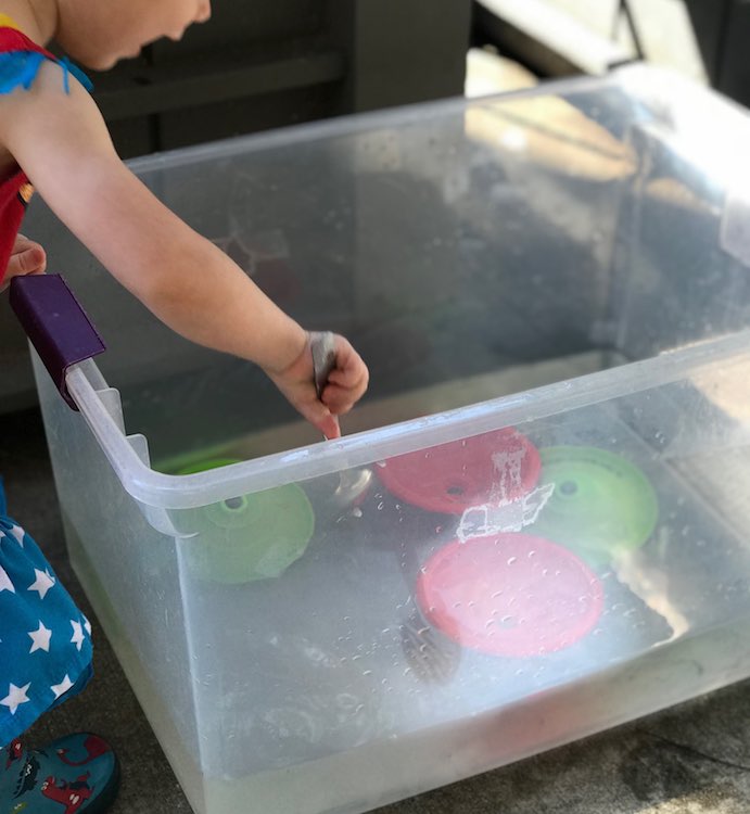 A bin of water can be handy to rinse off your toys and fingers.