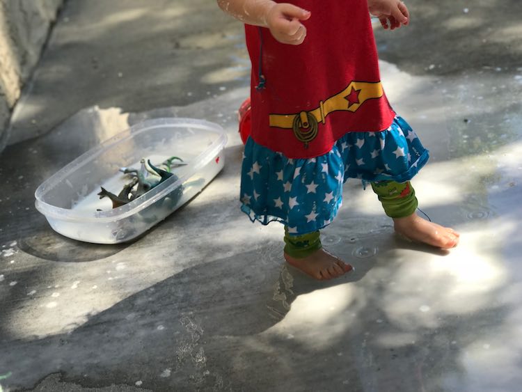 Zoey walking through the oobleck tinged water.