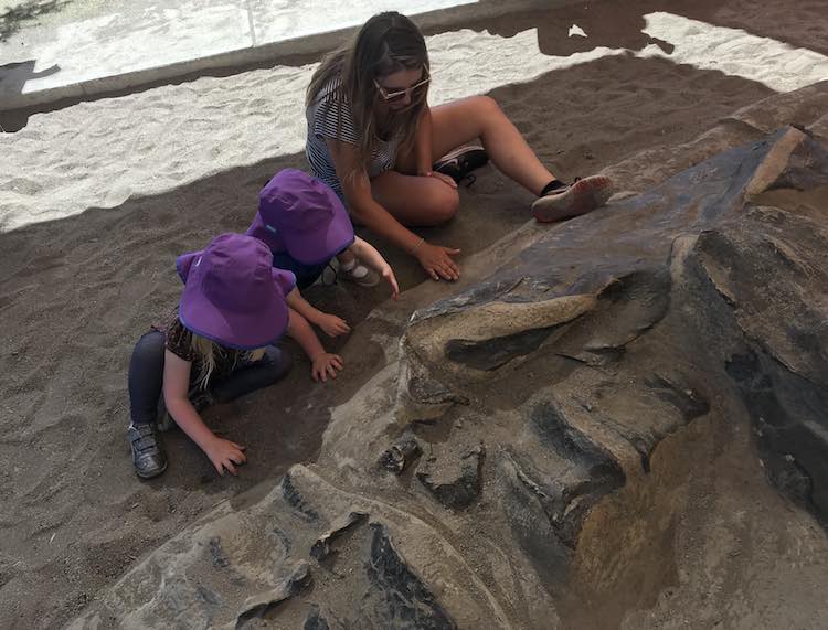 The playground area also included a dinosaur skeleton to dig up that the kids attempted with their Aunt. We didn't notice any paintbrushes or brooms so it ended up being a gentle excavation attempt by hand.