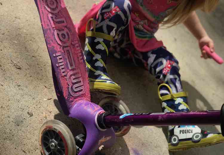 The purple scooter looks amazing in pink.