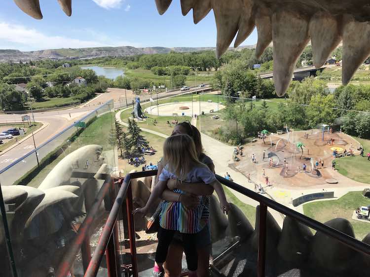 You have to lift the younger kids so they can enjoy the view and you might as well take a picture from inside the mouth while you're at it.