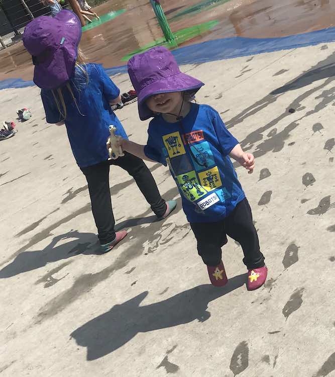 Robot shirts worn at a later time at a spray park.