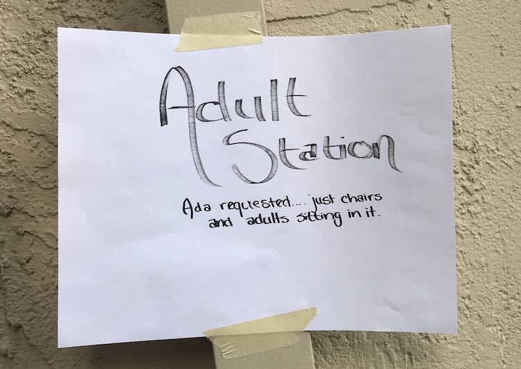Adult station sign: "Adult Station - Ada requested... just chairs and adults sitting on it".