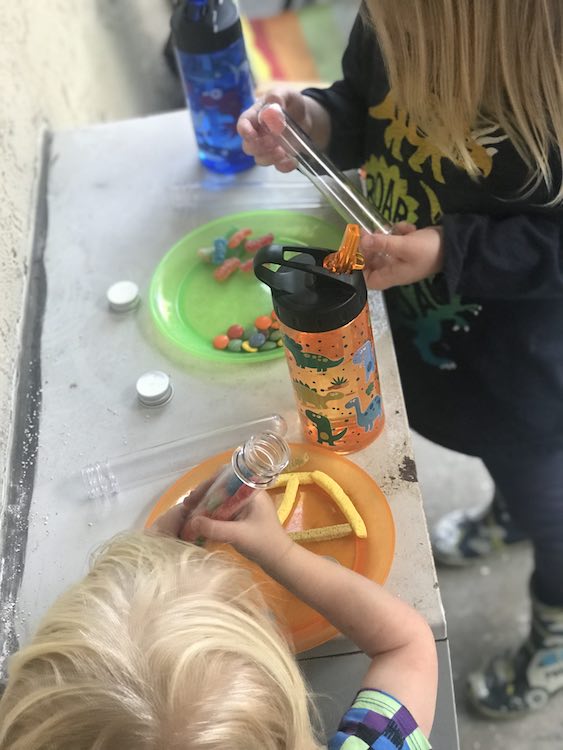 After Zoey's nap the kids had a blast dumping out the candy from their test tubes. We only ended up having one stuck candy that I got out easily and didn't have to go get a chopstitck to help.