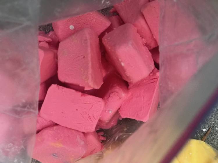 Bag of red oobleck cubes.