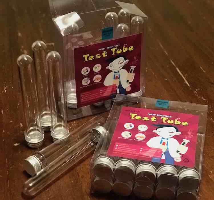 I bought two packages of food-safe test tubes through Amazlab on Amazon for the candy in the favor bags. After prewashing and letting them dry they were ready to be filled. The Amazon page also sold blood bags for Halloween parties so alot of the reviews were screwed towards them instead.