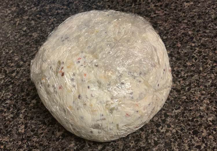 After mixing all my cheese ball ingredients together (leaving half the cooked quinoa aside) I used plastic wrap to help mold it into a ball instead of using my bare hands.