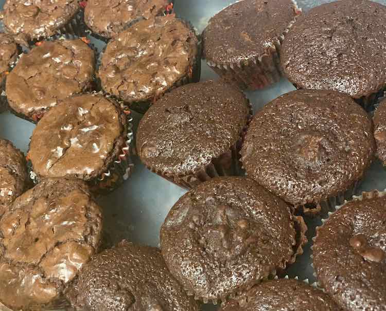 I made two batches of brownies and filled the cupcake liners so each batch made a dozen cupcakes... so I could bake both trays at the same time.