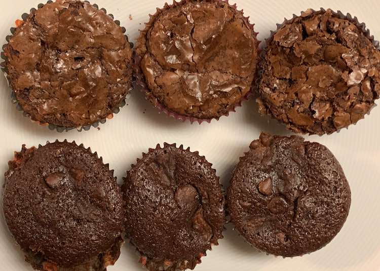 The top brownie-esque cracked top is the regular boxed brownies with coconut flakes and extra chocolate chips added. The bottom softer brownies didn't have the water added and instead had canned chunky pineapple (a third of a can) and all the pineapple juice.