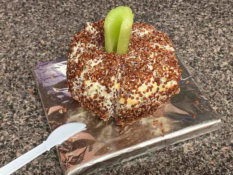 I cut off a piece of celery and added it to the top for a pumpkin stalk. When paired with a plastic knife for serving and a bag or two of crackers, tortilla chips, or the like it's a perfect side. The best part is there's no dishes or containers that you need to remember to bring home after the party.