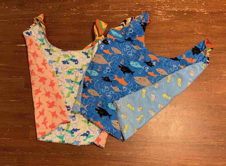 The finished bags inside out to show off the lining. Love how both bags have dinosaurs on them yet the kids chose different dinosaurs.