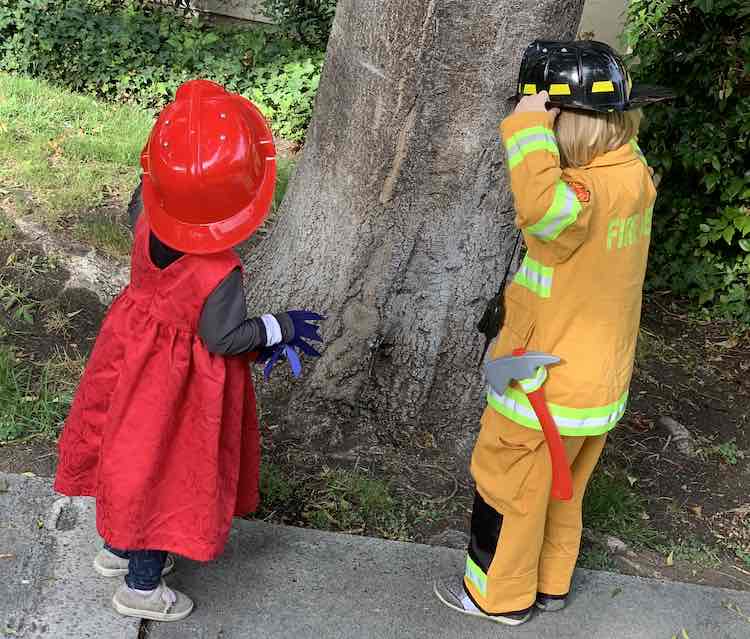 Zoey and Ada dressed up as a firetruck and firefighter. 