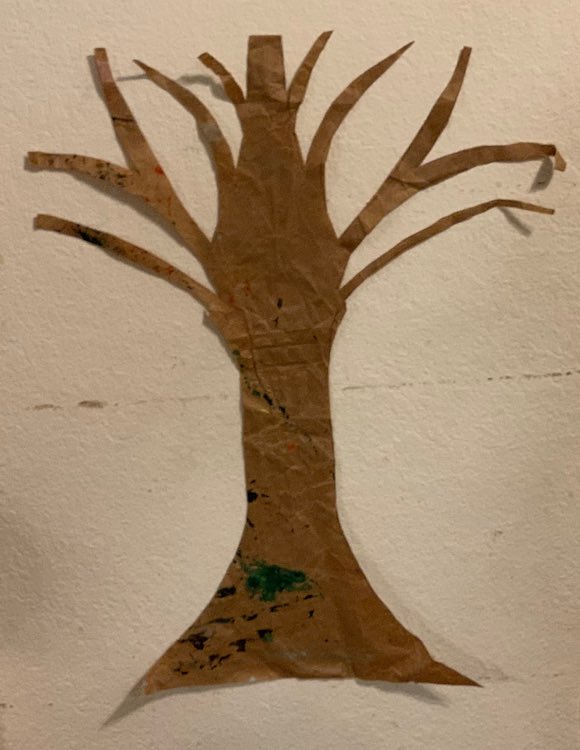 I took small pieces of masking tape and rolled them with the stickiness on the outside to make simple double-sided tape that I wouldn't worry about pulling off the wall later. I attached three along the tree trunk and used smaller pieces near the end of each branch.