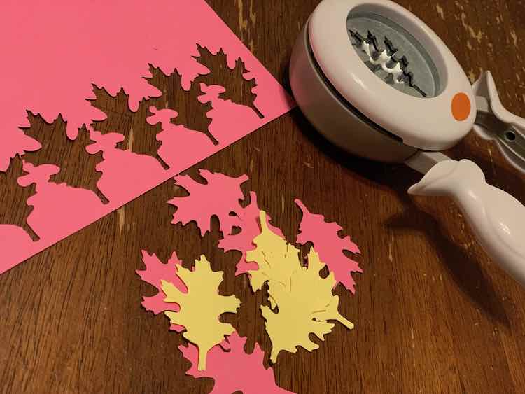 Bought a Fiskars oak leaf punch for the leaves so punched a bunch leaves out of a sheet of yellow and (Ada-chosen) pink card stock.