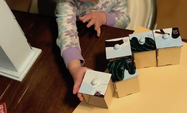 Zoey loved playing with the advent calendar as Ada was focused on the new item.