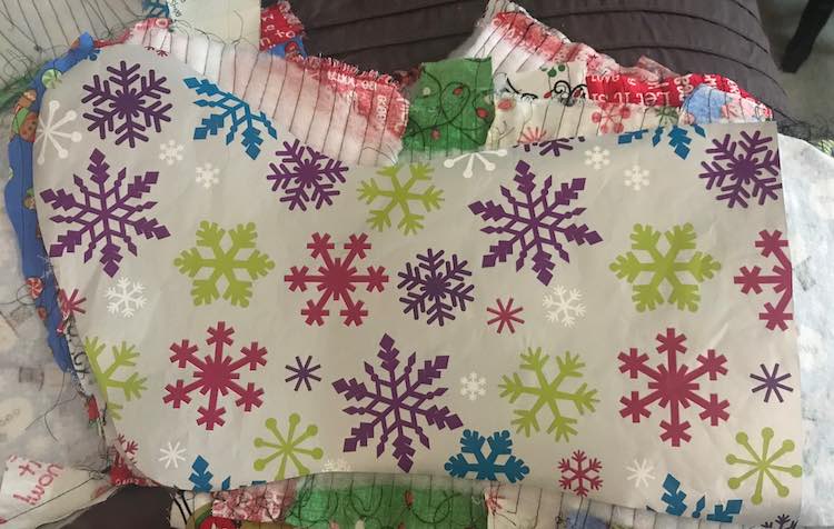 I followed the tutorial on Diary of a Quilter so I next pinned the top of each outer quilted stocking right sides together with the corresponding liner and sewed them together.