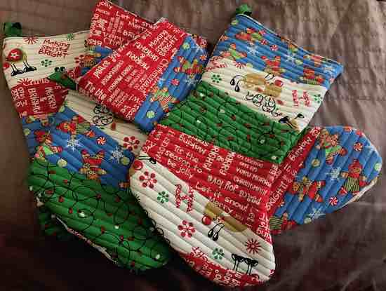 Four Christmas stockings made from the last fabric purchased.