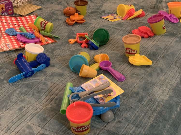 Then seperated the toys into ten piles and matched up one colored container to each pile.