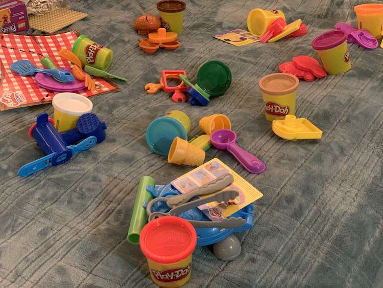 Then seperated the toys into ten piles and matched up one colored container to each pile.