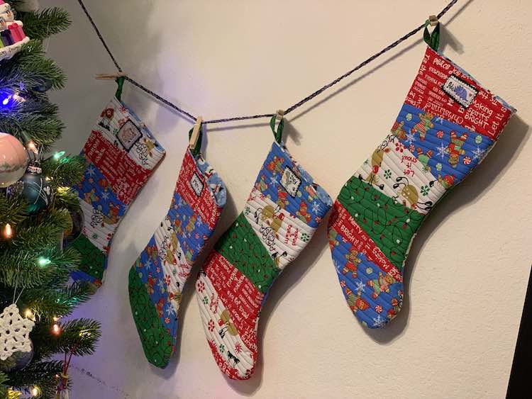 When we set up the Christmas tree I switched out the art hanging up and instead hung up the stockings. They're a bit heavy but with the art line being so stretched out already I figured it was fine. 