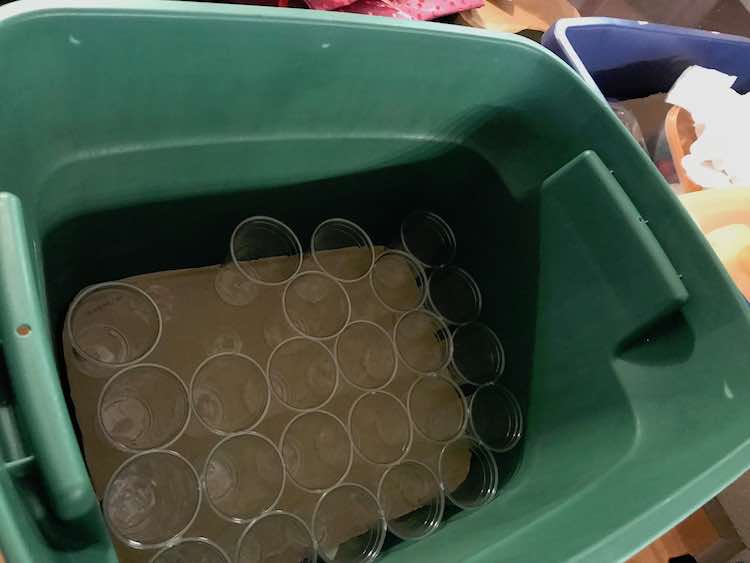 My first solution consisted of a bin filled with cardboard and cups. I could see this lasting longer if we had more storage space and used wider cups.