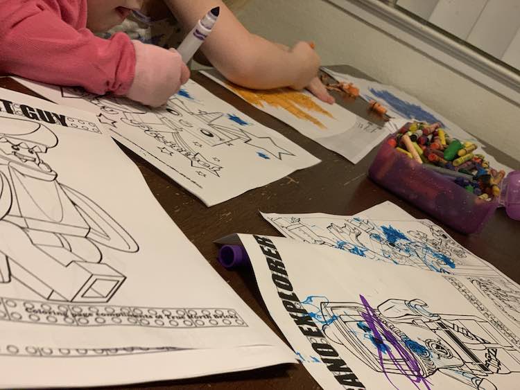 Ada and Zoey coloring their onslaught of new coloring pages.