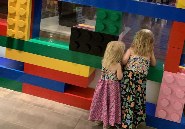 LEGO® dresses by large LEGO® bricks.