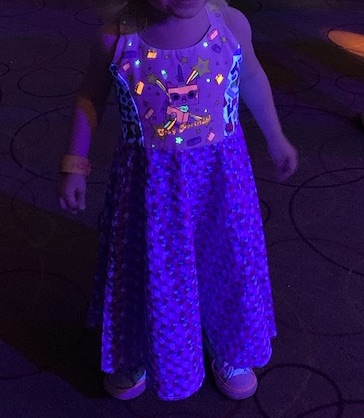 Zoey's black lit dress.