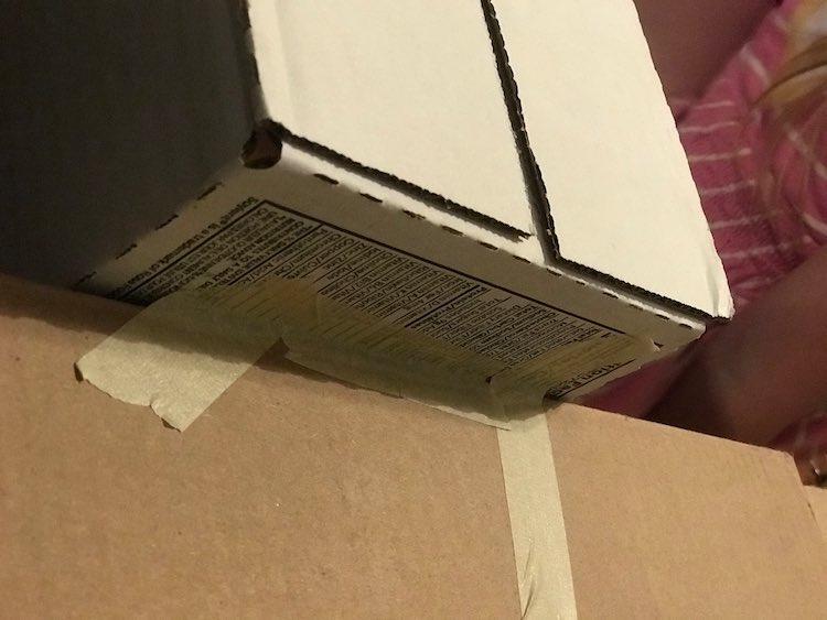 The shelving is overlapping the cupboard by a couple inches and then was taped together so it couldn’t move.