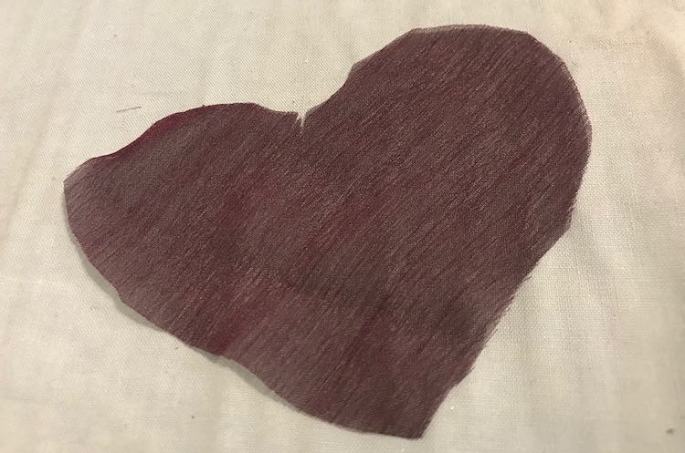 Purple heart cut out from the excess purple chiffon.