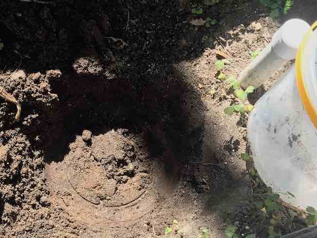 Dug the hole for the bucket while periodically checking the fit of the bucket inside of the hole.