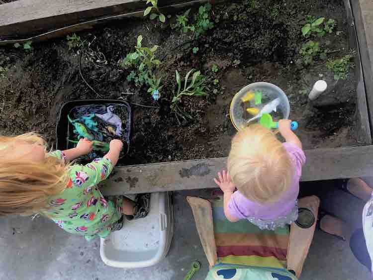 Ada and Zoey playing with the plain water pools.
