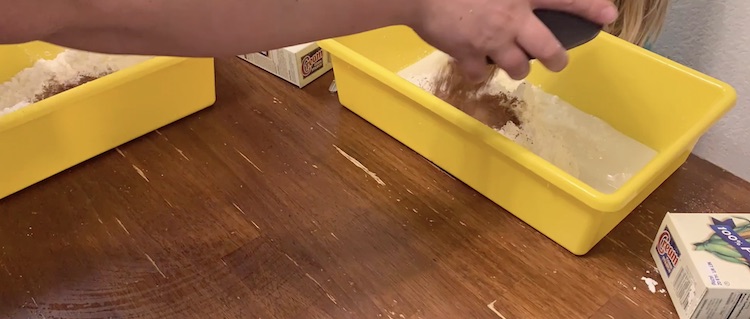 Splitting up the last of the cocoa powder between the girls.