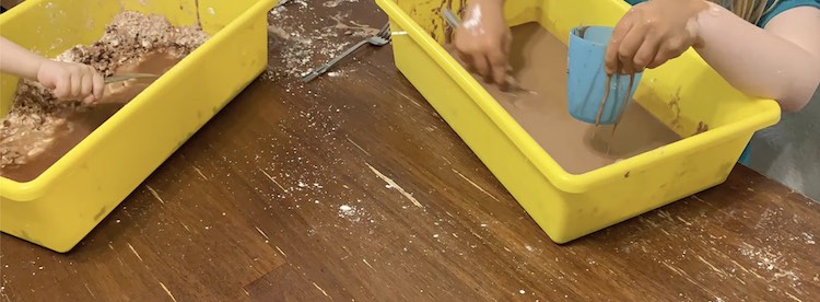 Ada loved filling her cup with her runny oobleck while Zoey didn't fully mix her together so had cornstarch islands in her runny muddy oobleck.