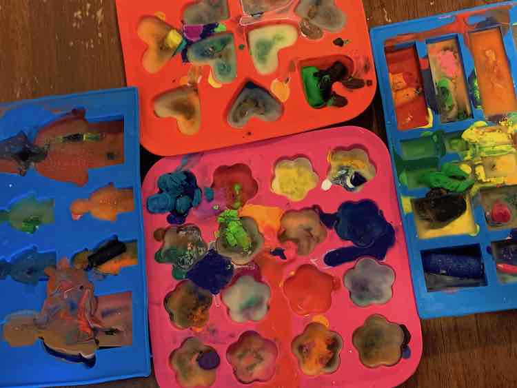 Filled, melted, and hardened crayons in the moulds.