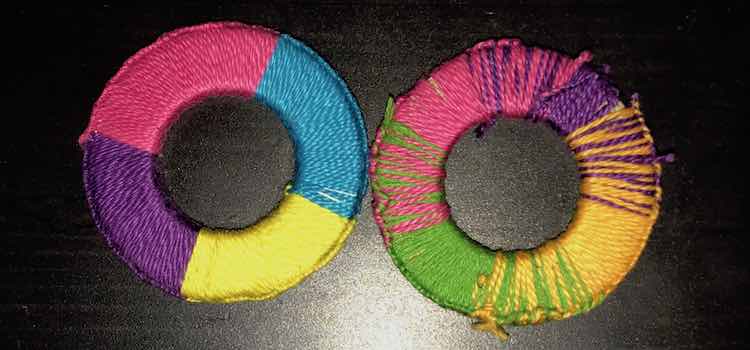 The washer on the left has abrupt colors changes starting with pink, blue, yellow, and blue. The washer on the right also consists of four colors (pink, purple, darker yellow, and green) but the more gradual changes almost trick your eyes making you think there are five colors. 